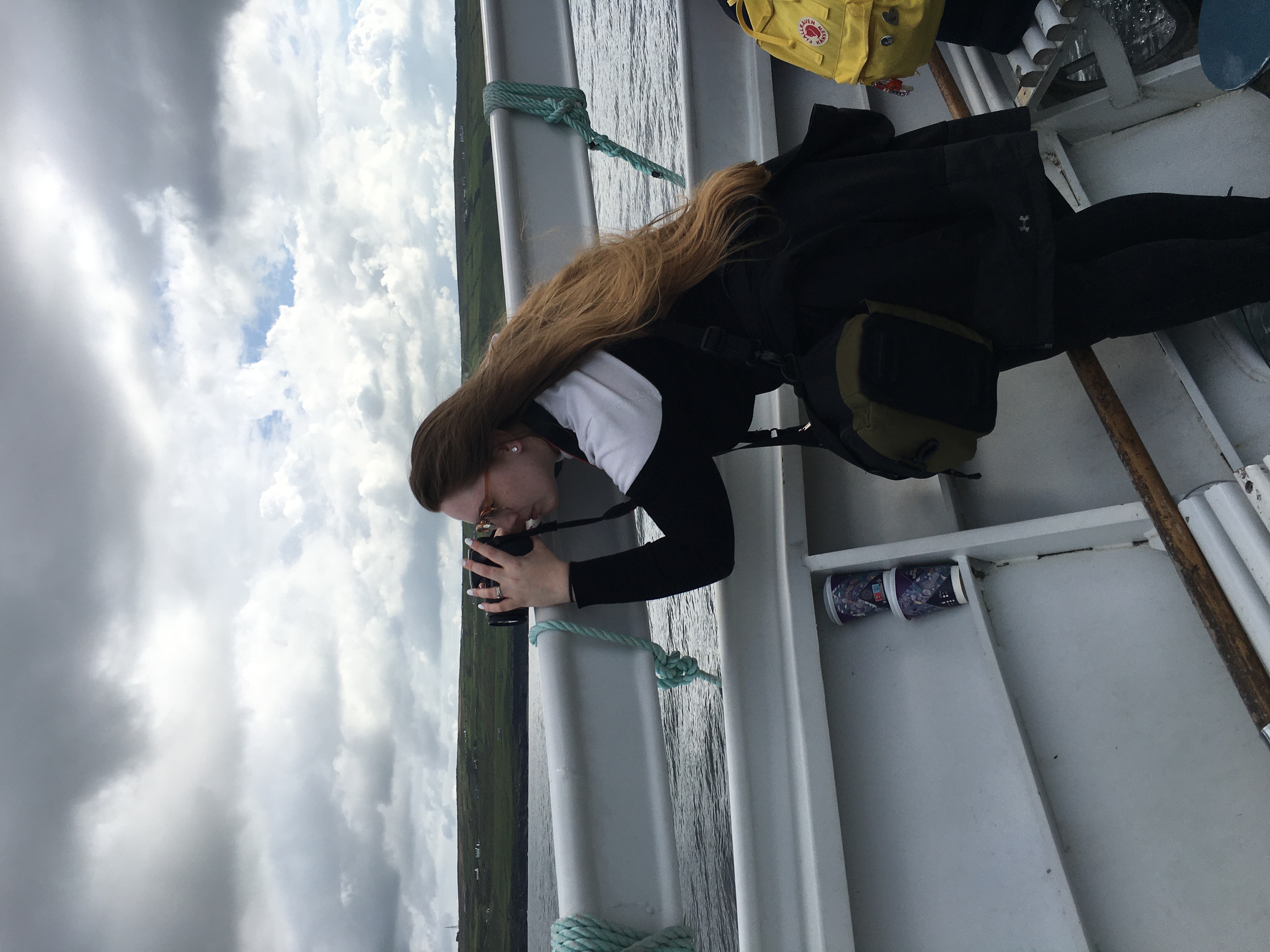 Brittany practicing photography on a boat.