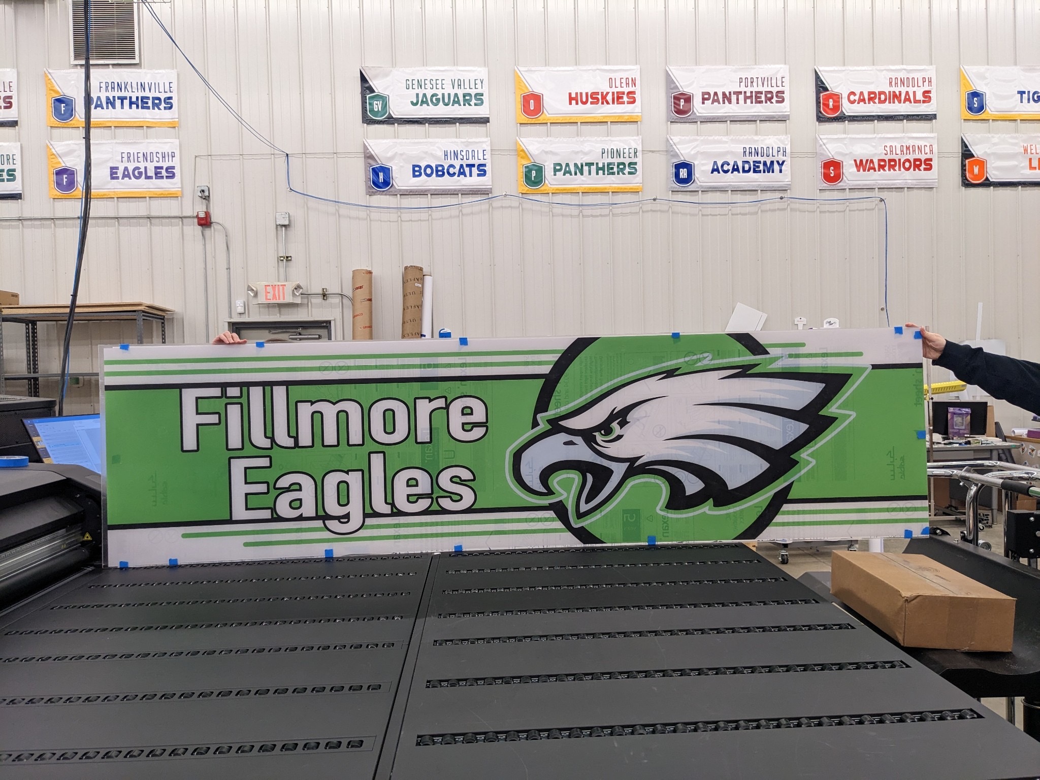 Green panel with Fillmore Eagles text and an eagle head logo.