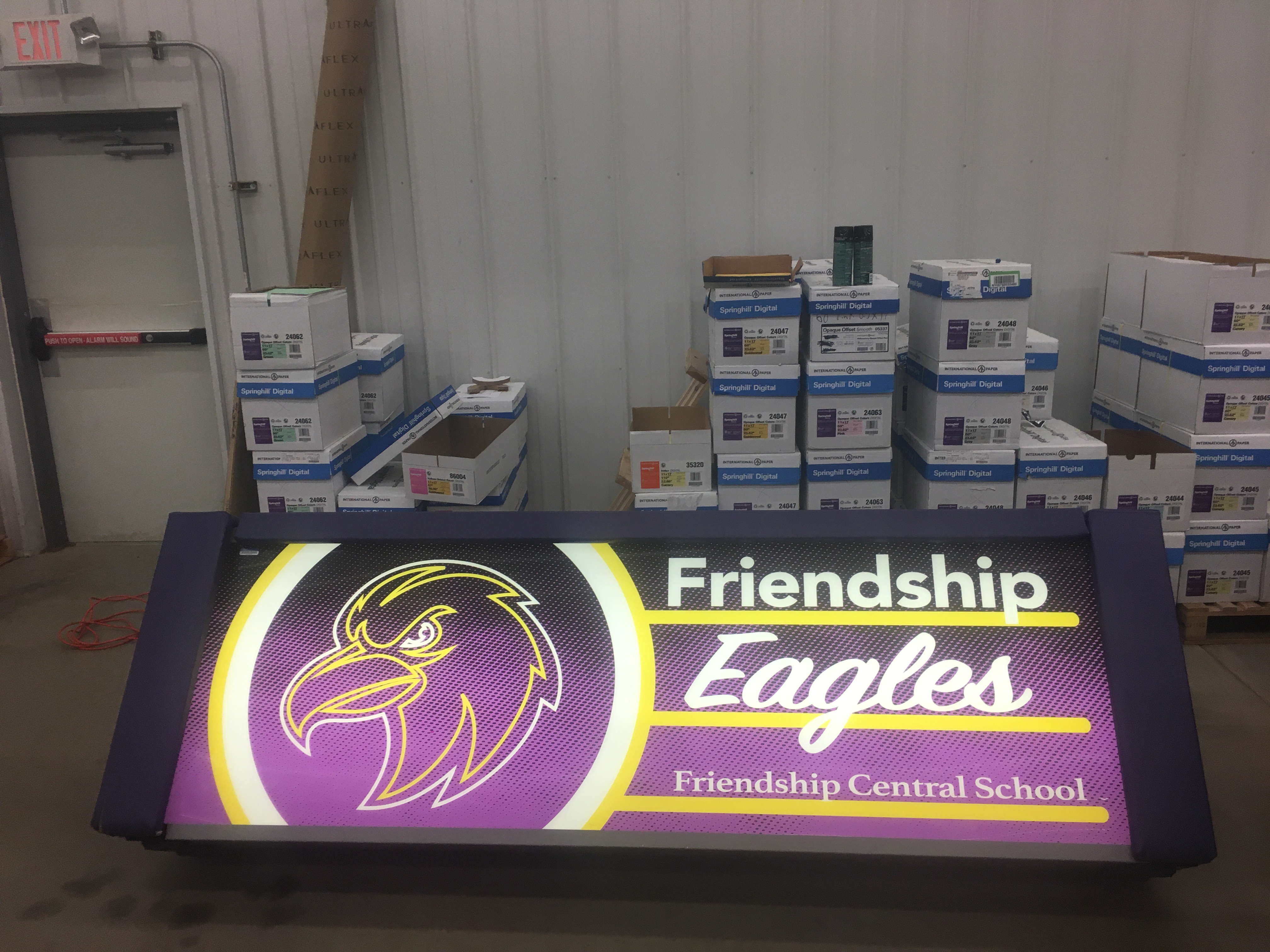 Purple and yellow graphic with Friendship eagles text and eagle logo.