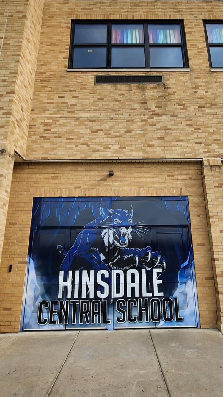 Large format door wrap designed for the side entrance of HSD. Features school mascot and colors.