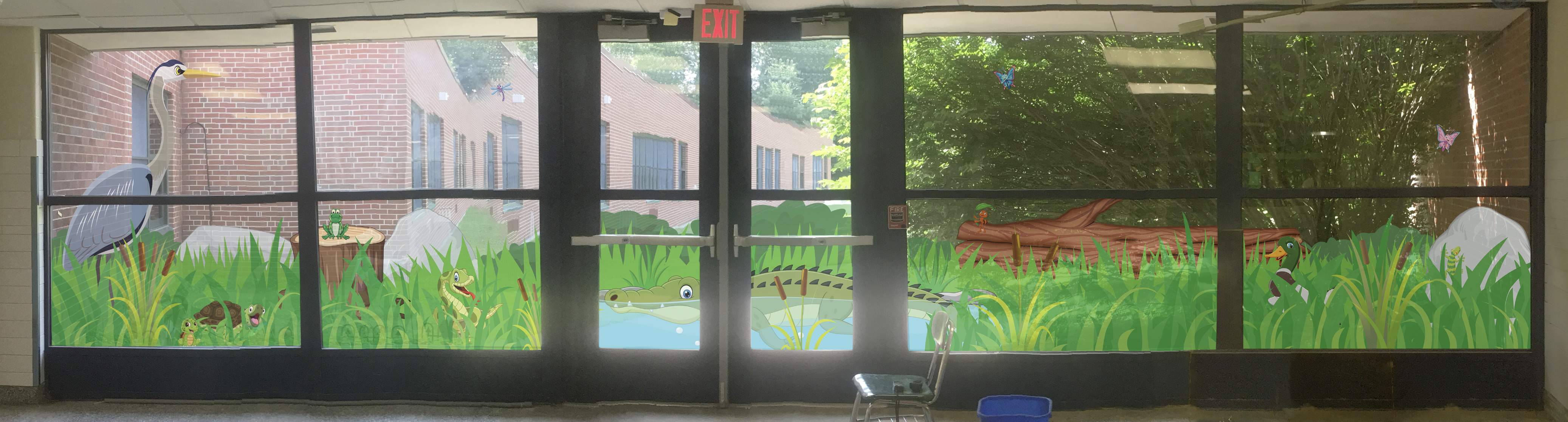 Large graphic featuring animals in a swamp environment.